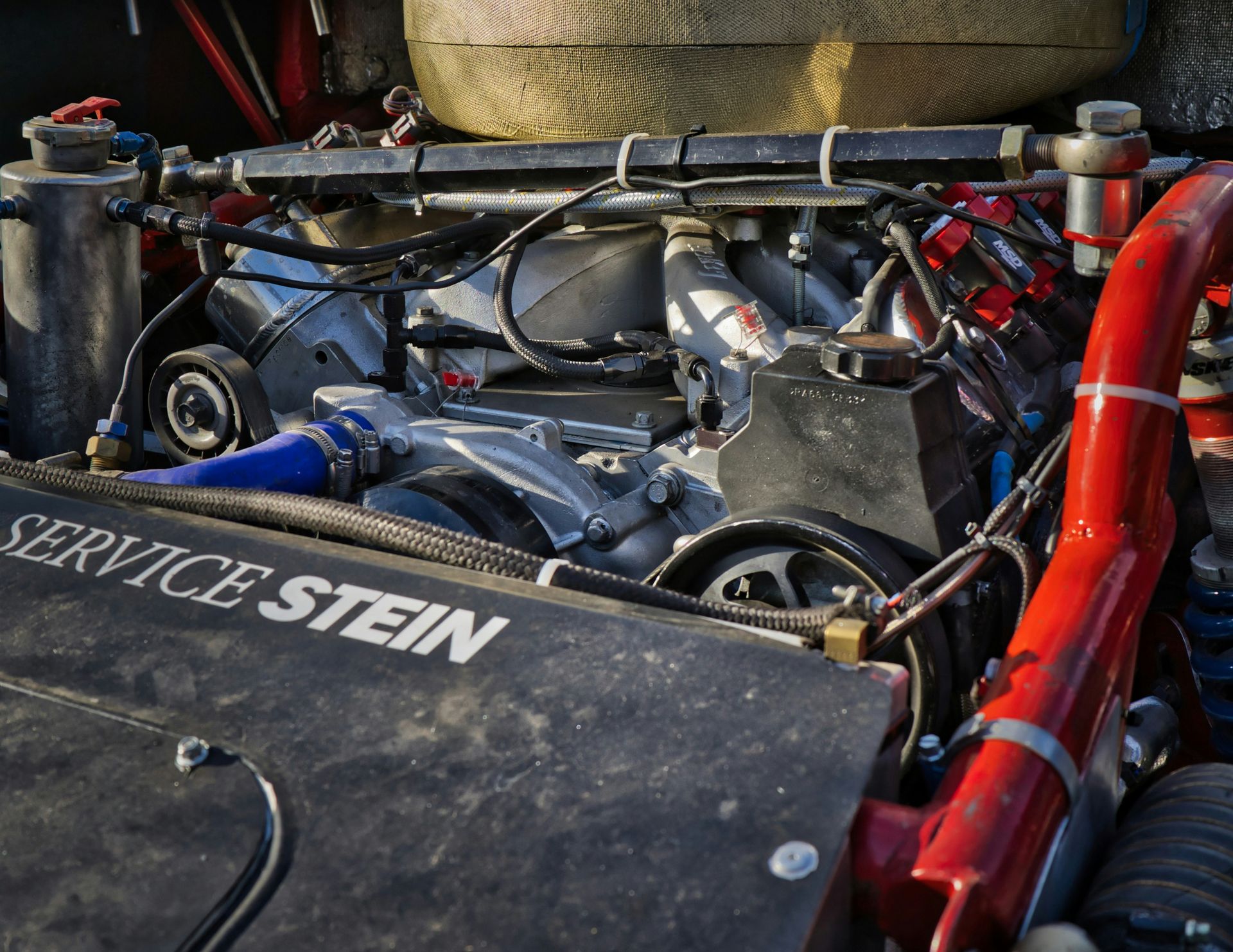 An engine bay of a vehicle is displayed.